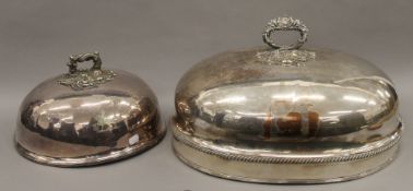 Two silver plated meat covers. The largest 47 cm long.