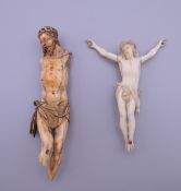An 18th century ivory model of Christ and a 19th century example. The former 13 cm high.