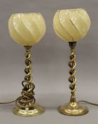 A pair of brass table lamps. The largest 40 cm high.