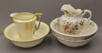 A Victorian florally decorated jug and bowl, an Art Deco jug and bowl and another bowl.