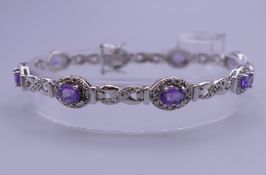 An amethyst and marcasite bracelet. 18 cm long.