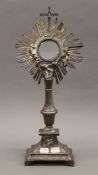 A French white metal monstrance. 43.5 cm high.