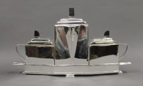 An Art Deco style silver plated tea set. 39 cm wide.