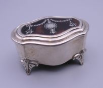 A silver and tortoiseshell trinket box. 7 cm wide.
