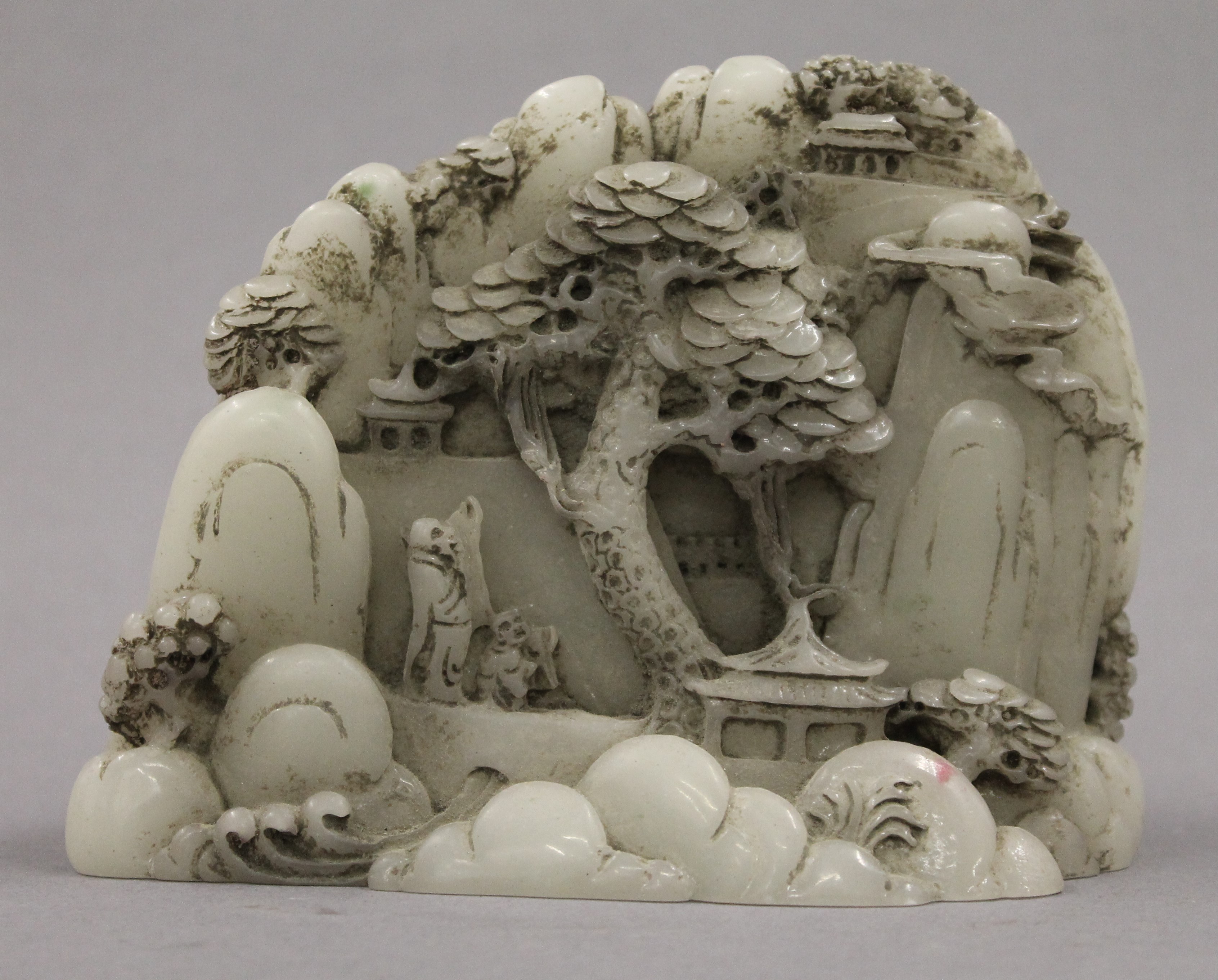 A Chinese model of a mountainous landscape. 13 cm wide.