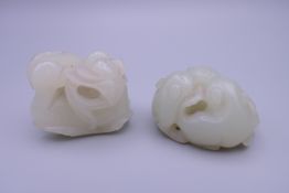 Two Chinese mutton fat jade carvings, one formed as ducks, the other as three cats.