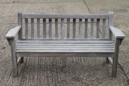 A garden bench. 165 cm wide, 86 cm high, 60 cm deep.