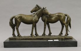 A bronze model of two horses. 38 cm long.