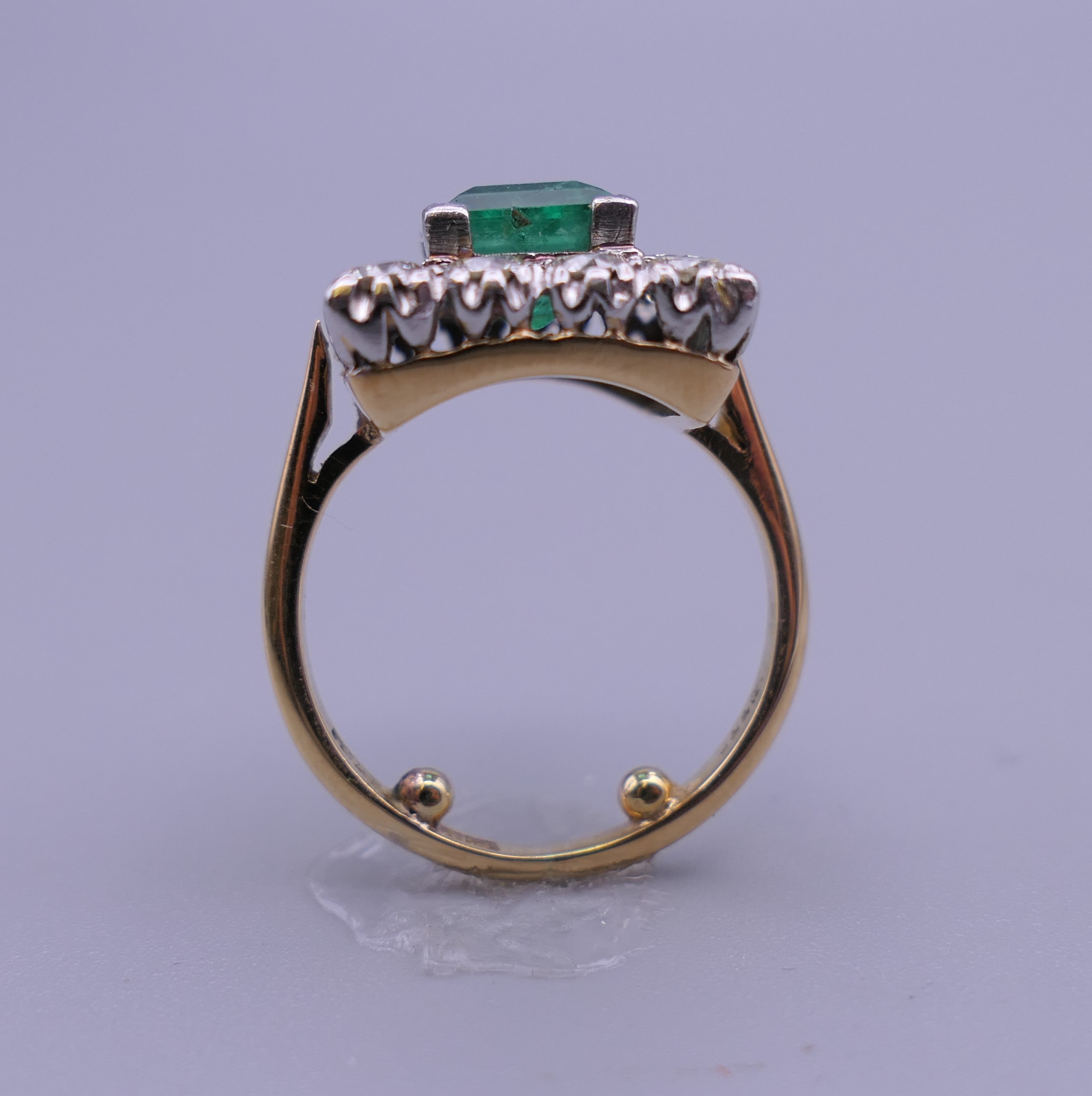 An 18 ct gold and platinum emerald and diamond ring. Ring size H/I (with previous sizing mounts). 1. - Image 2 of 8