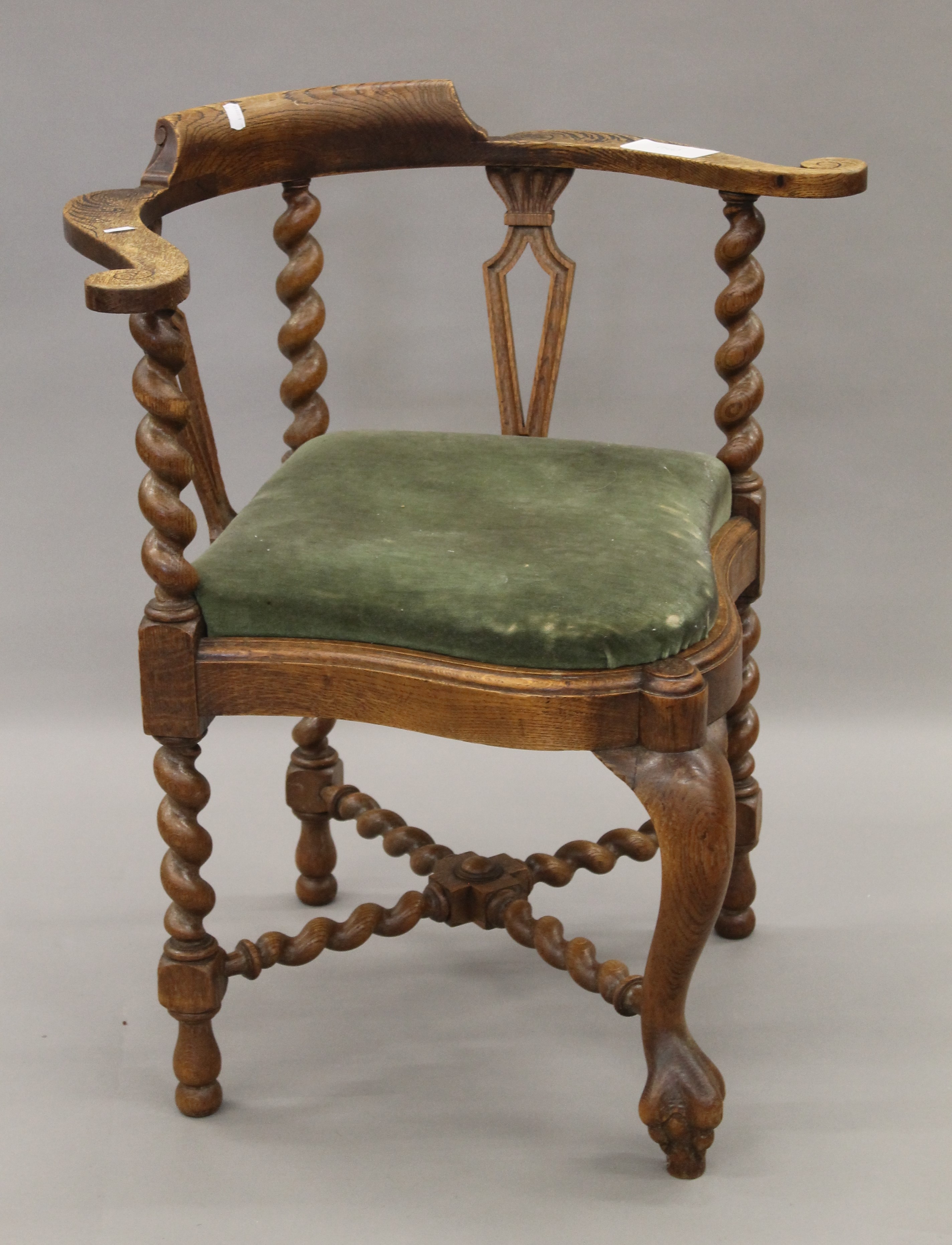 A Victorian oak barley twist corner chair. 73 cm wide.