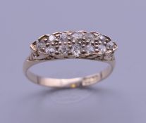 An 18 ct gold diamond navette ring. Ring size P/Q. 2.5 grammes total weight.