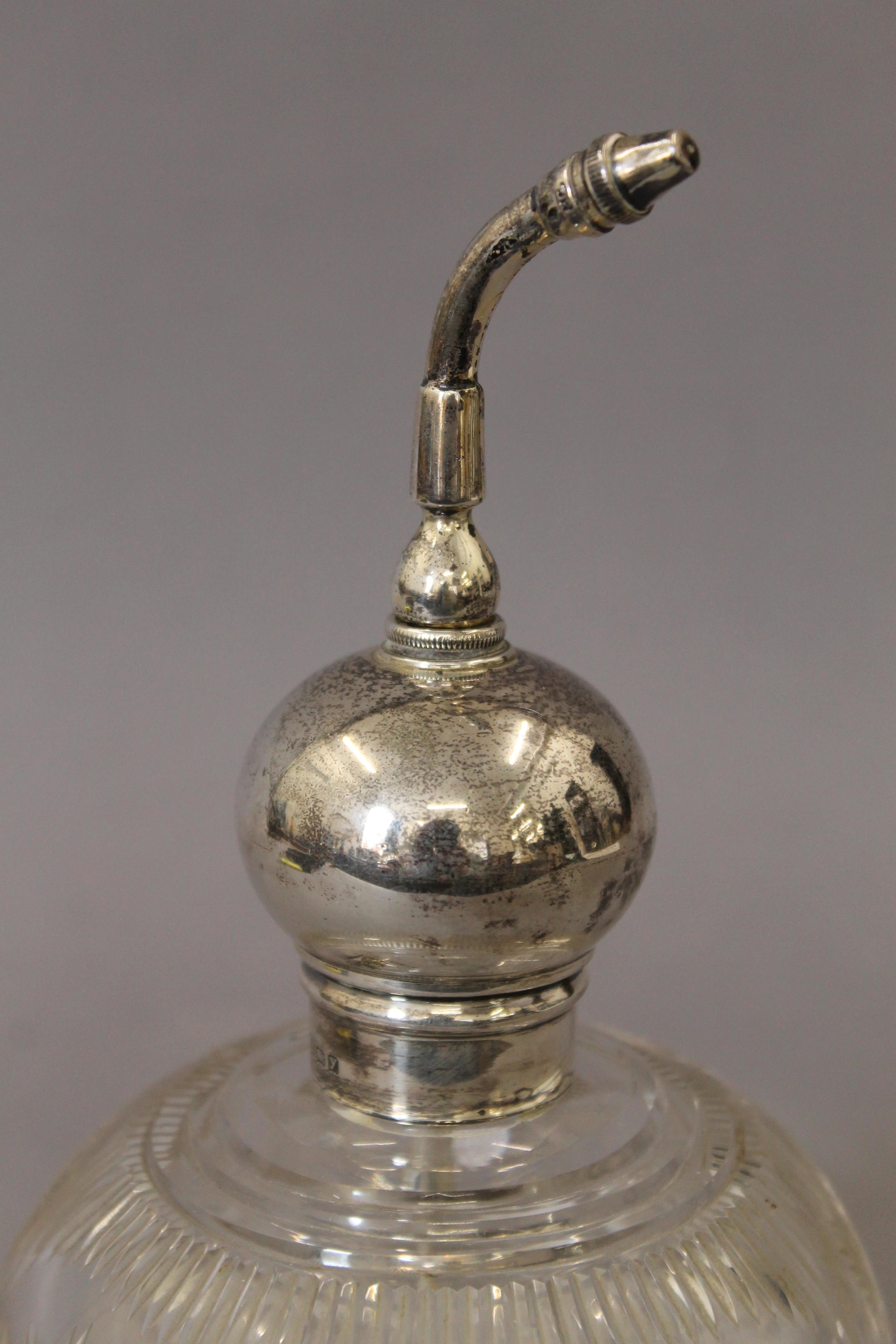 A silver topped atomiser scent bottle. 19.5 cm high. - Image 2 of 4