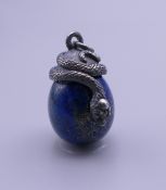 A lapiz egg form pendant mounted with a snake. 2.5 cm high.