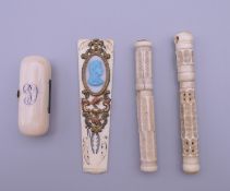 A small 19th century ivory box, a piece of a fan guard and two bone needle cases.