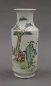 A Chinese porcelain vase decorated with a man and boy. 24 cm high.