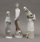 Three Lladro figures, including Don Quixote.