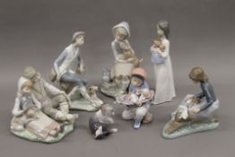 A quantity of Lladro and Nao figurines.