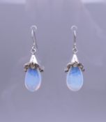 A pair of Art Nouveau style 925 sterling silver drop earrings. 3 cm high.