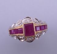 A 9 ct gold Art Deco style ruby and diamond ring. Ring size M.