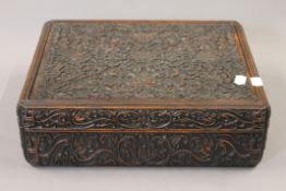 A Chinese carved hardwood box. 36 cm long.