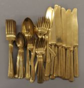 A quantity of gilt cutlery.