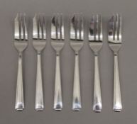 A cased set of silver cake forks. 3.9 troy ounces.