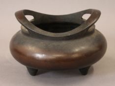 A Chinese bronze censer. 19 cm wide.