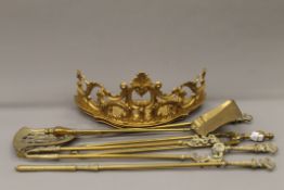 A quantity of brass fire irons and a gilt wall bracket. The latter 48 cm wide.