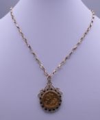 A half sovereign set pendant in a 9 ct gold mount on a 9 ct gold chain. 14.8 grammes total weight.