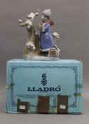 A boxed Lladro figure, Nina de invierno.