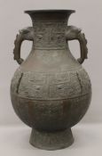 A large Chinese bronze archaic style vase. 61 cm high.