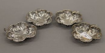 Four pierced silver trefoil bon-bon dishes. Each 9.5 cm wide. 4.1 troy ounces.