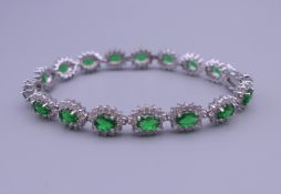 A 925 silver synthetic emerald bracelet. 18 cm long.