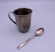 A silver beaker and spoon. The former 7 cm high. 76.3 grammes.