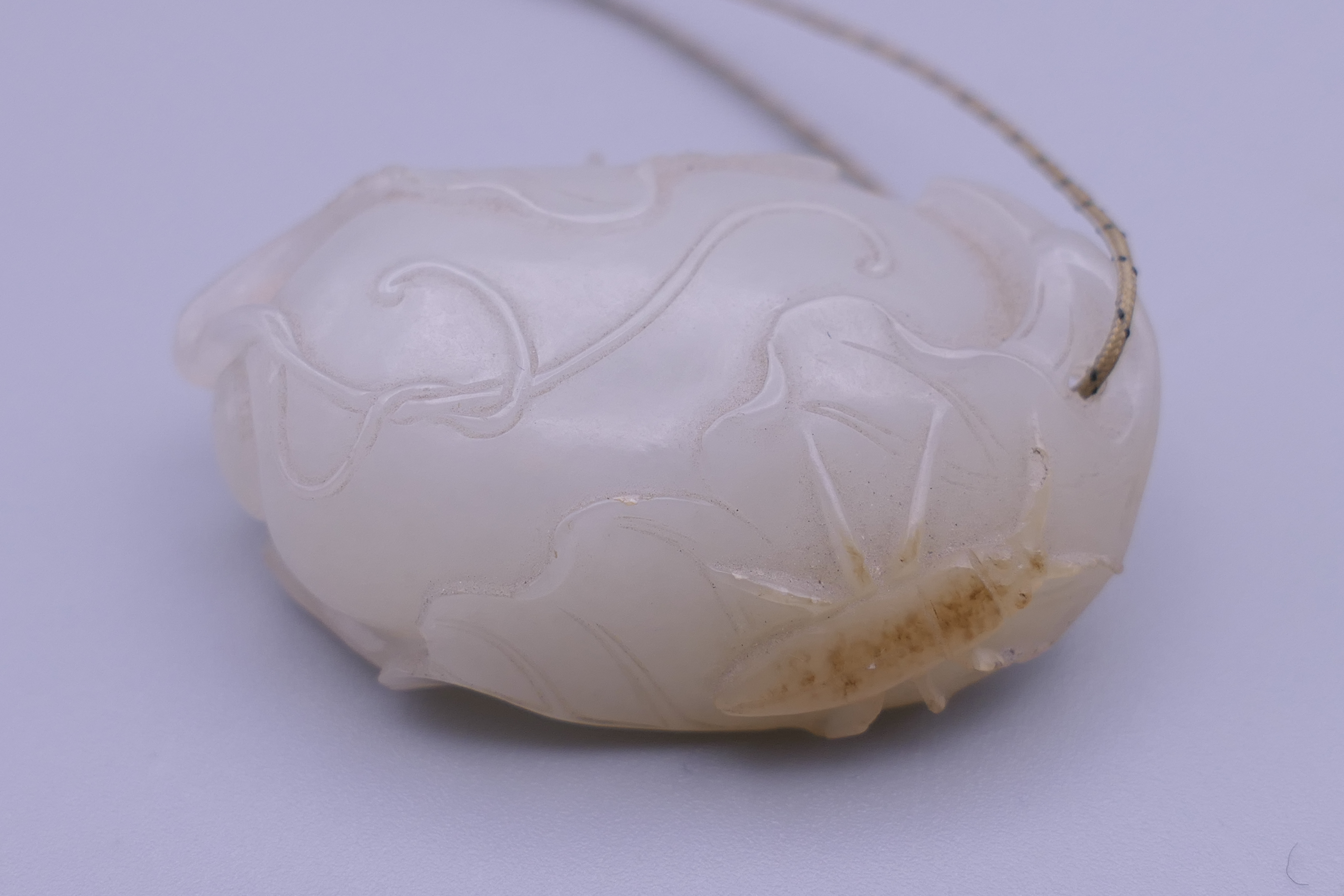 A Chinese mutton fat carved jade pendant, formed as insects on a flowering fruit. 4.5 cm high. - Image 3 of 13