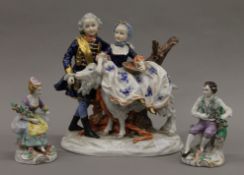 An Unterweissbach porcelain figural group and two Sitzendorf figures. The former 22 cm high.