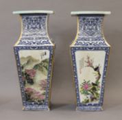 A pair of Chinese porcelain vases decorated with mountainous landscapes. 44 cm high.