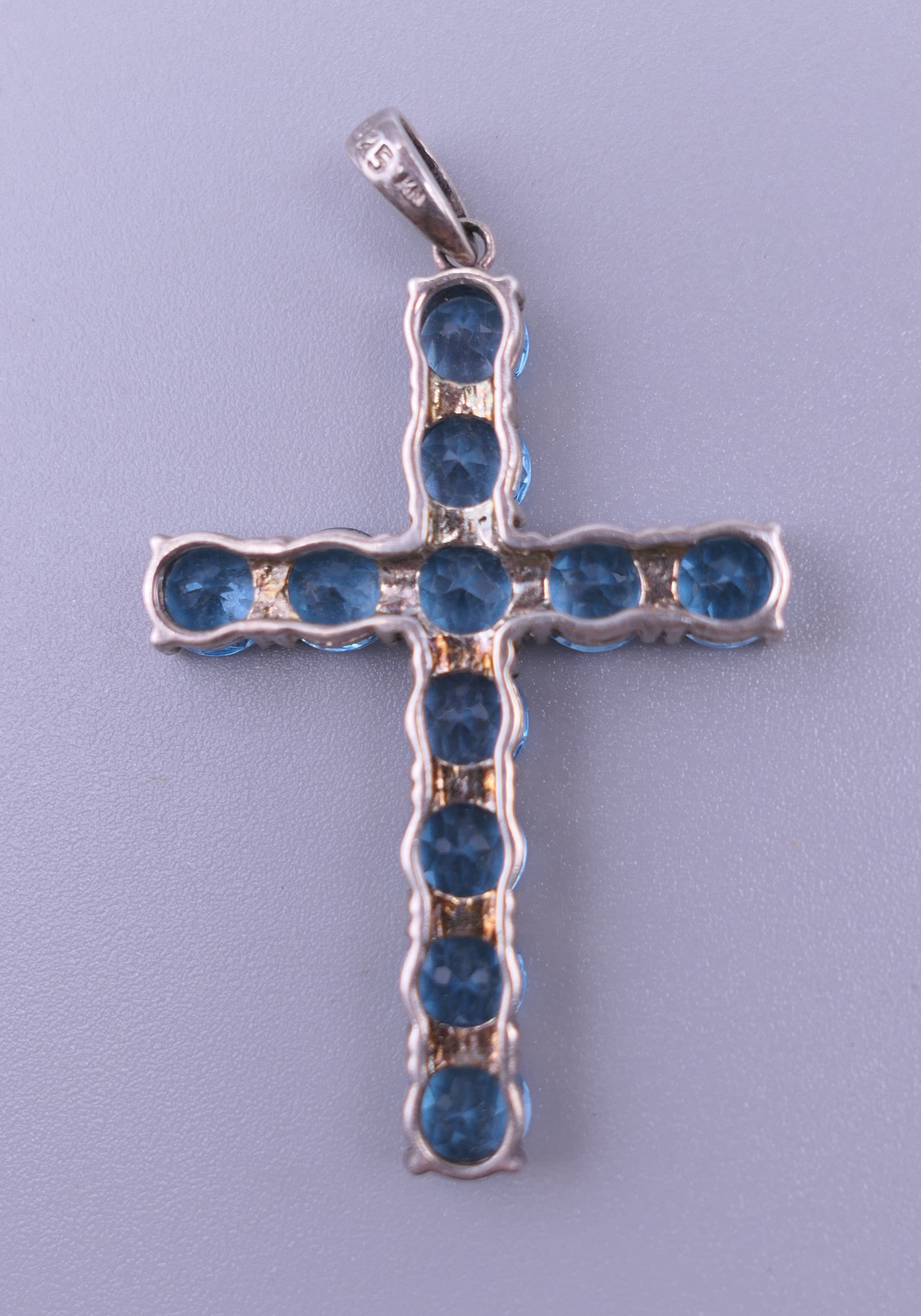 A sterling silver blue stone cross pendant, - Image 3 of 12