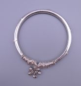 A vintage Asian silver bangle. 6.5 cm diameter.