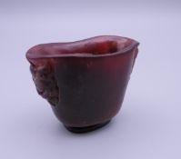 A small libation cup. 5 cm high.