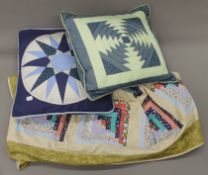 A patchwork quilt and two cushions