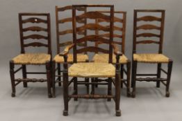 Seven various rush seated ladder back chairs.