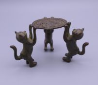 A small bronze model of cats. 4.25 cm high.