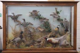 Various preserved taxidermy specimens housed in a pair of specially commissioned oak cabinets,