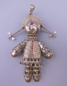 WITHDRAWN A 9 ct gold rag doll pendant. 9.5 cm high. 33.2 grammes total weight.