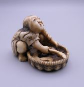 A 19th century Japanese ivory netsuke formed as a fisherman. 3 cm high.