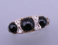 A 9 ct gold Victorian style onyx and diamond ring. Ring size N.