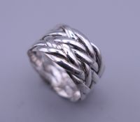 A silver plait ring. Ring size O/P.