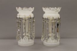 A pair of Victorian milk glass lustres. Each 34.5 cm high.