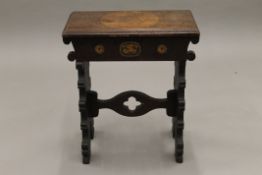 A Victorian pokerwork stool. 46 cm wide.